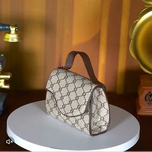 NIB small saddle shaped purse with crossbody strap